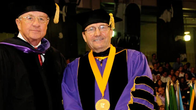 Al Annexstad, left, with former University president Richard Davenport. Annexstad and his wife Cathy were awarded honorary doctorates, two of only five given in the University’s history.