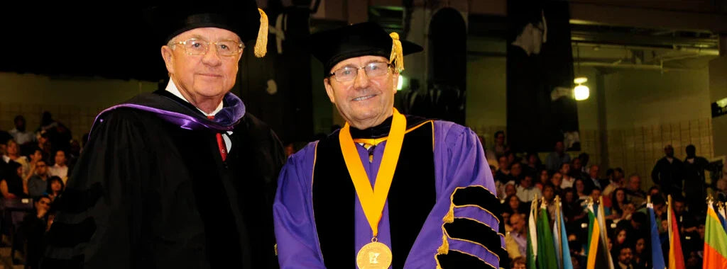 Al Annexstad, left, with former University president Richard Davenport. Annexstad and his wife Cathy were awarded honorary doctorates, two of only five given in the University’s history.